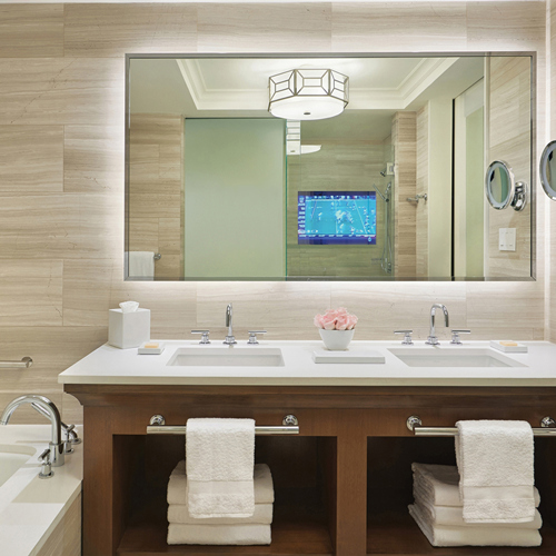 Framed LED backlit bathroom mirror