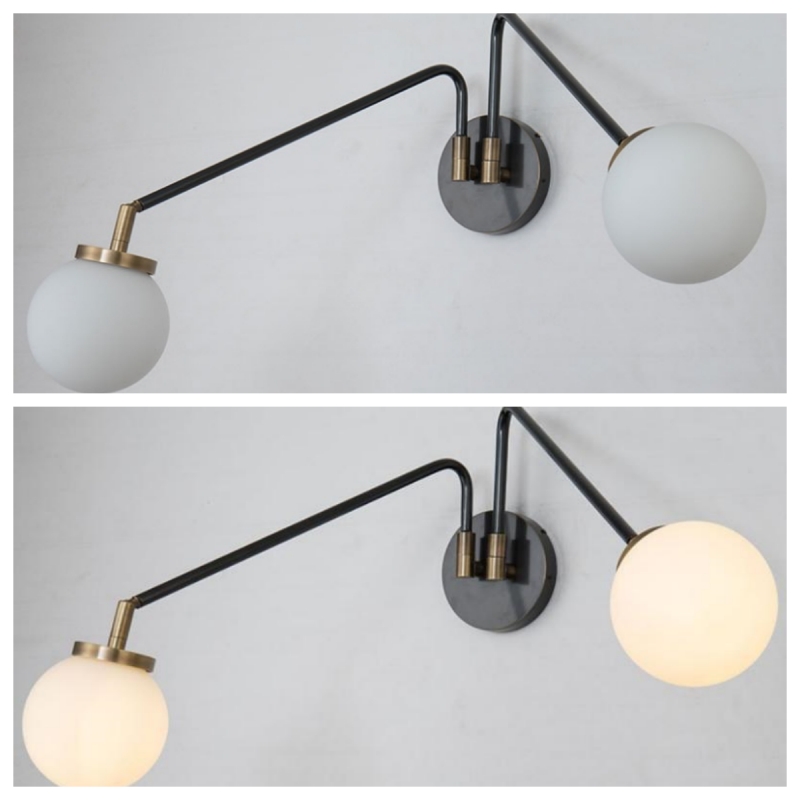 Double swing arm wall light